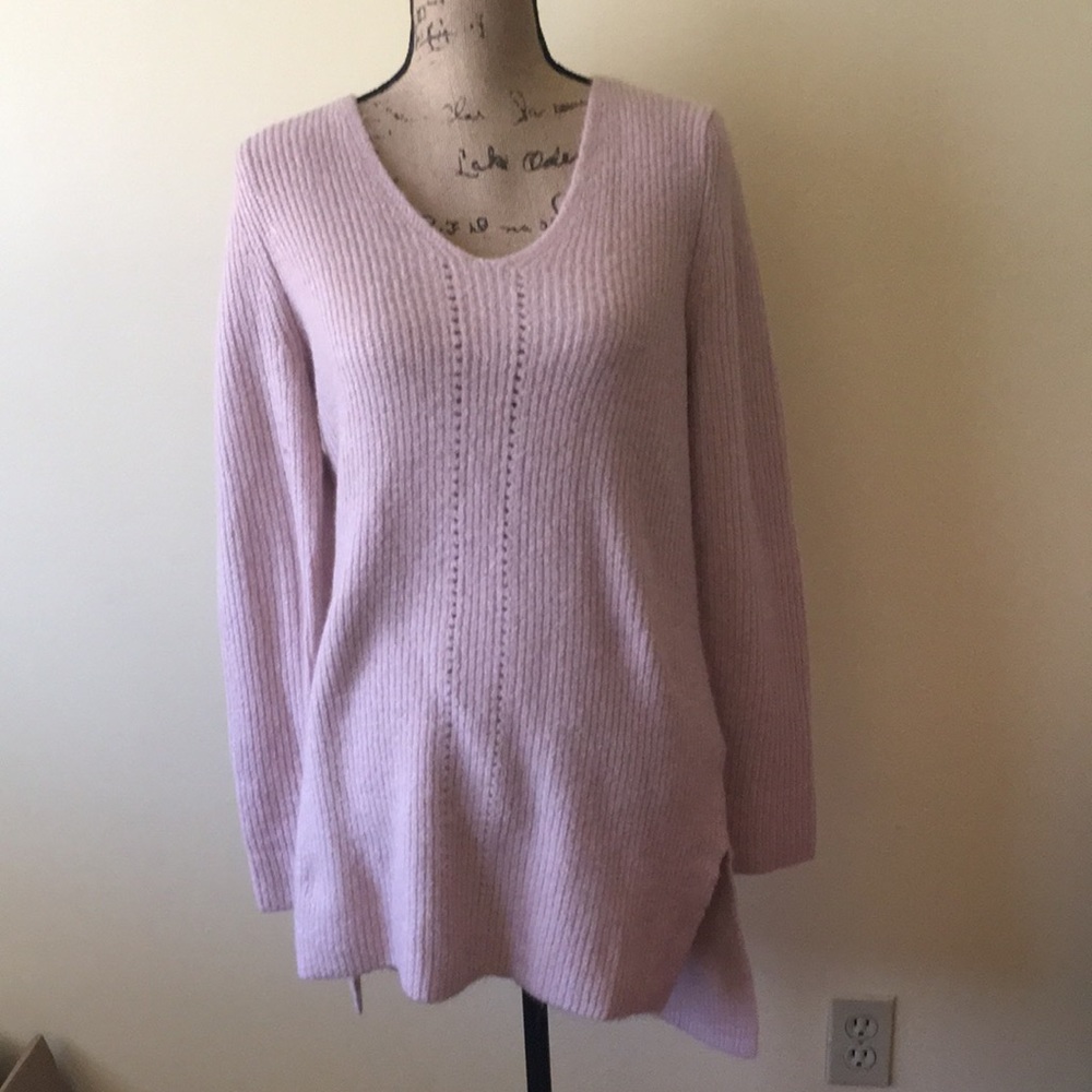 Nice muted pink sweater, soft to the touch.